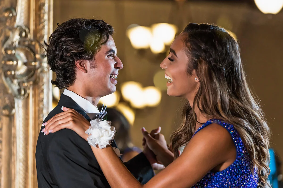 Teenage couple dressed for prom, slow dancing