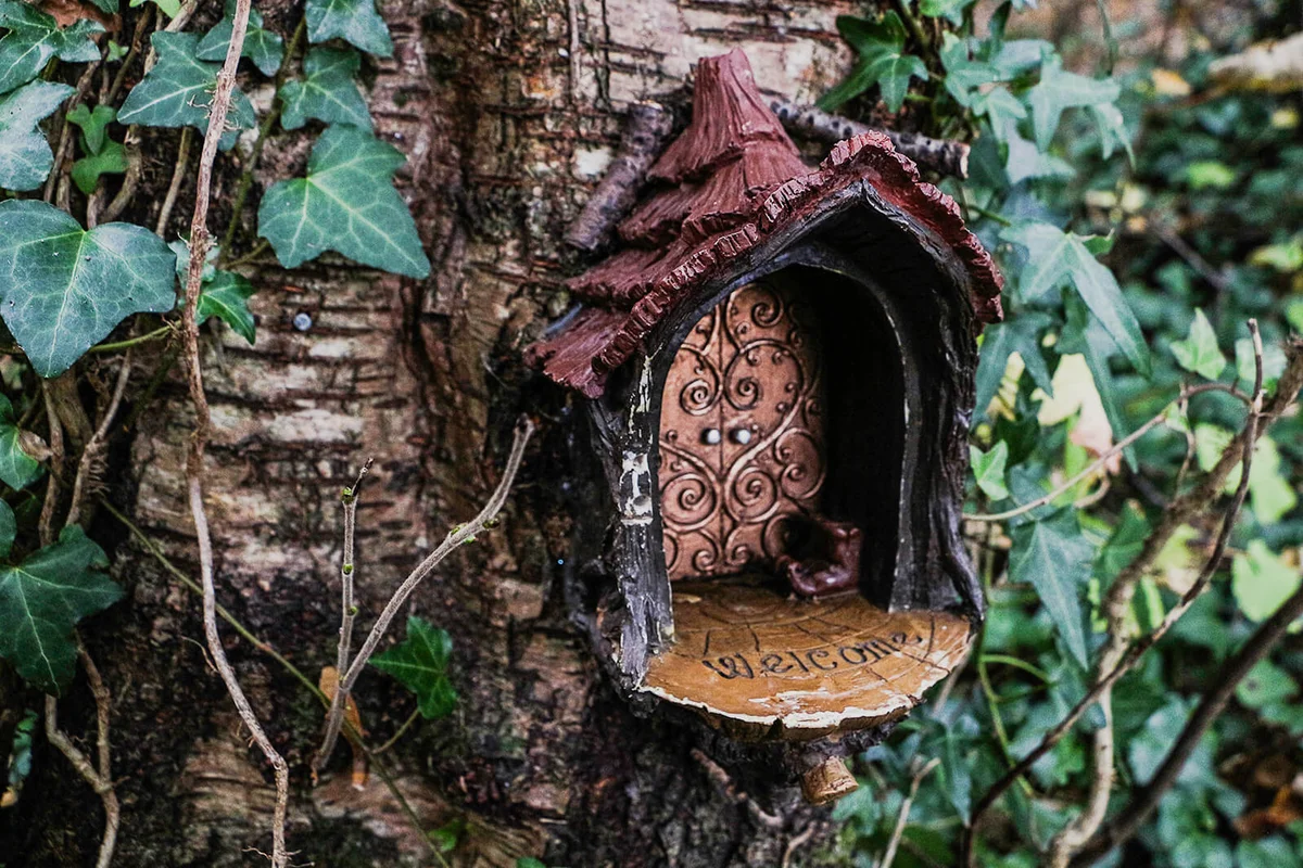 A fairy house front door in a trunk