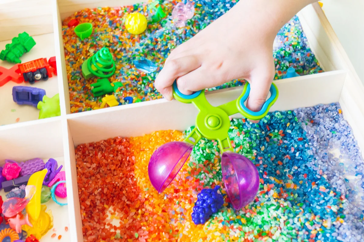 Sensory box with rainbow rice