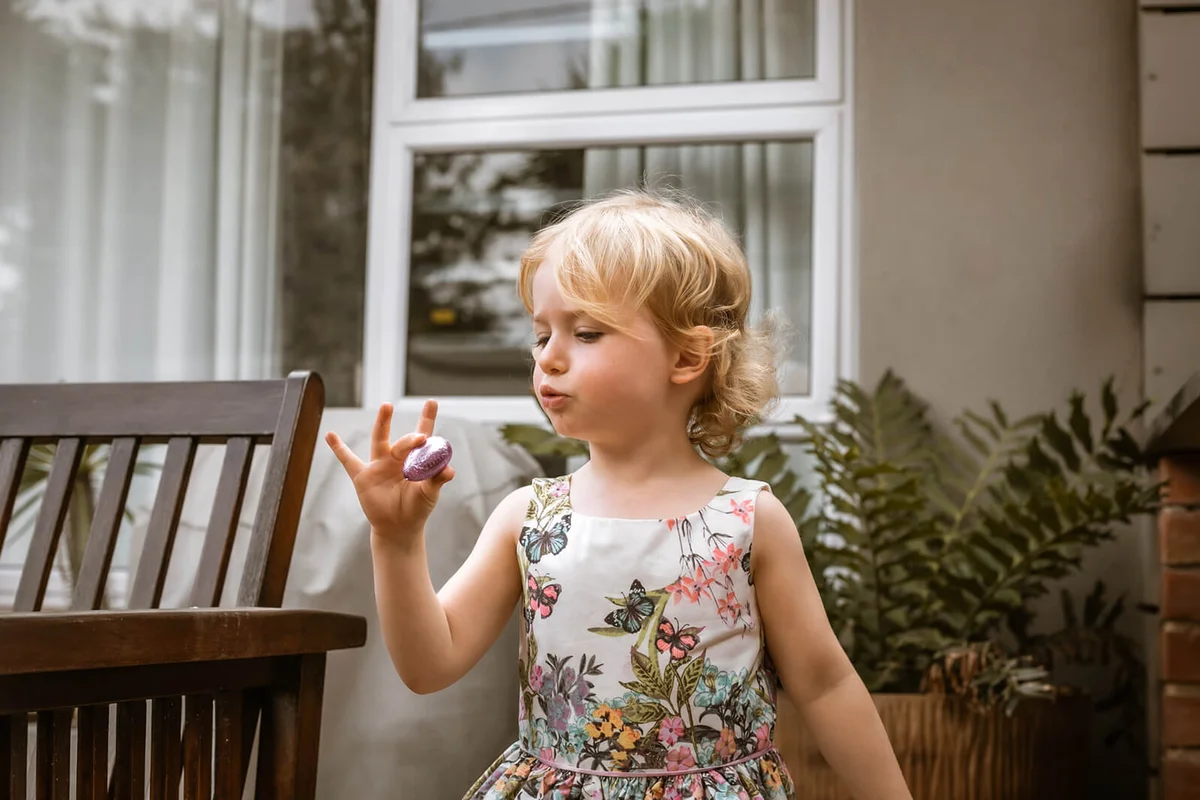 Little girl looking for easter eggs