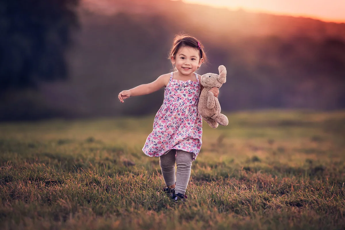 Toddler Girl Running Toward Me At Sunset