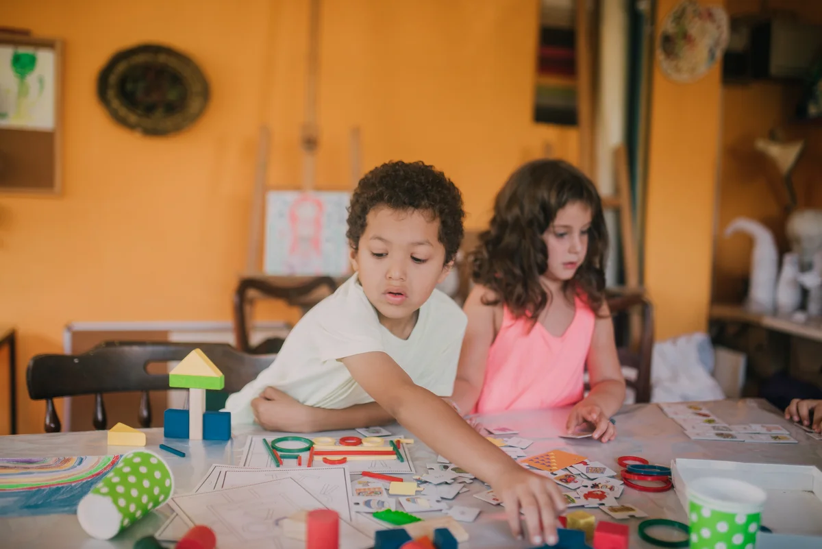 two kids doing art