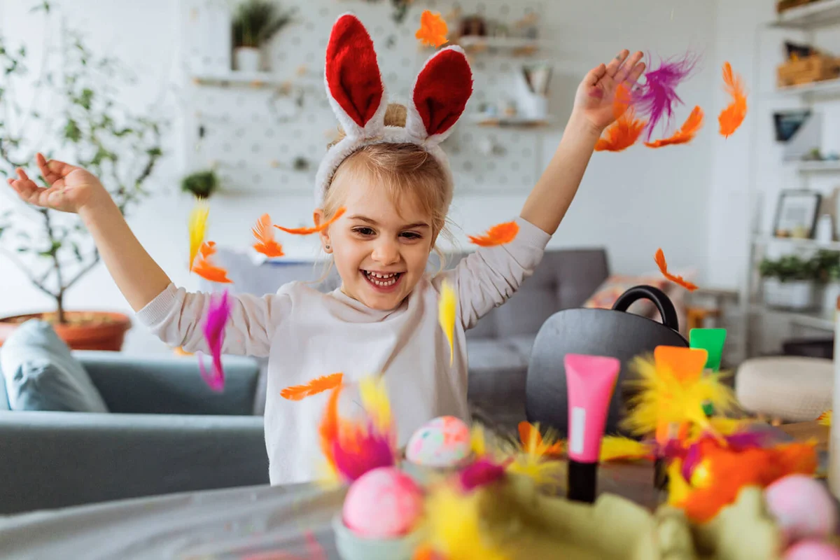 Little girl having fun during Easter preparation