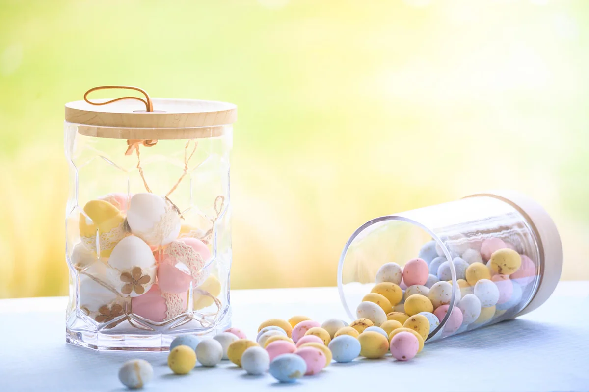 Easter eggs fallen from a glass jar