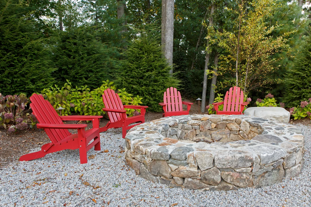 fire pit with red chairs
