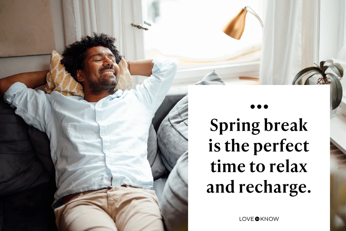 Smiling man with eyes closed resting on sofa at home