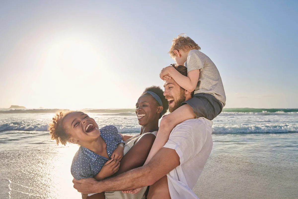 Family playing on beach