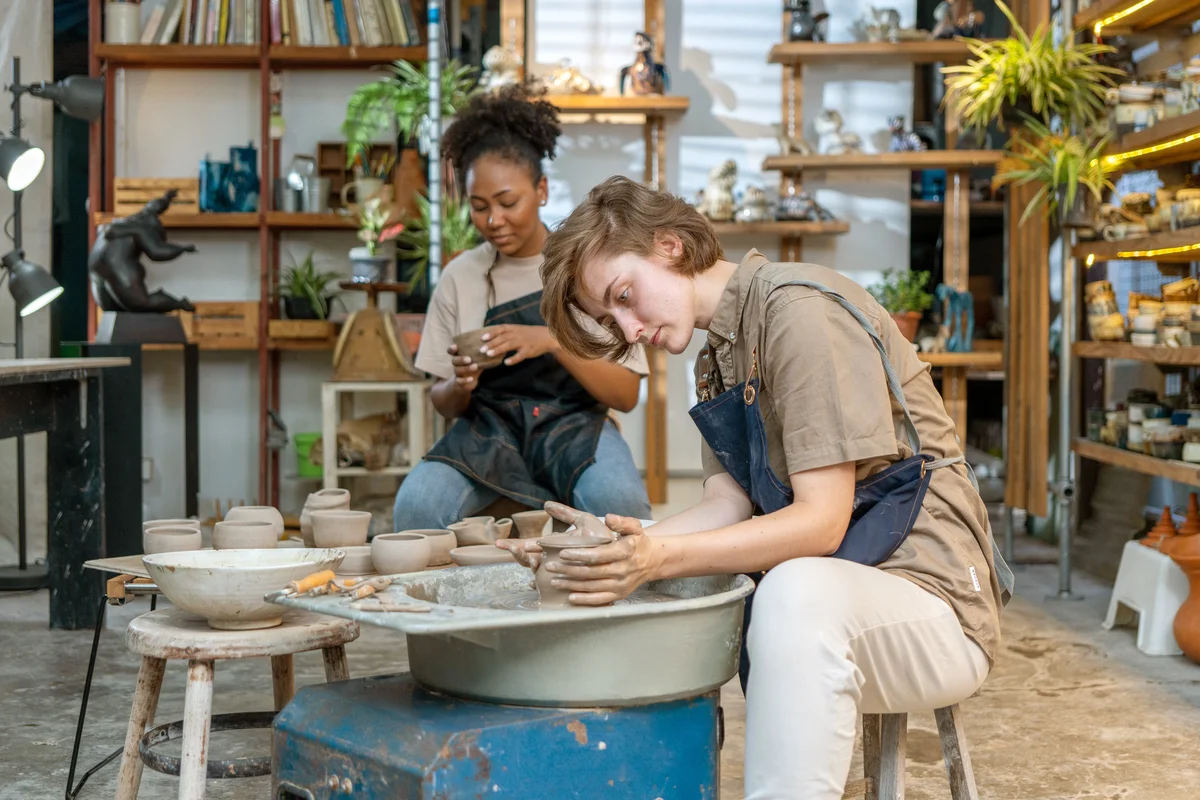 Women making pottery in a ceramics studio