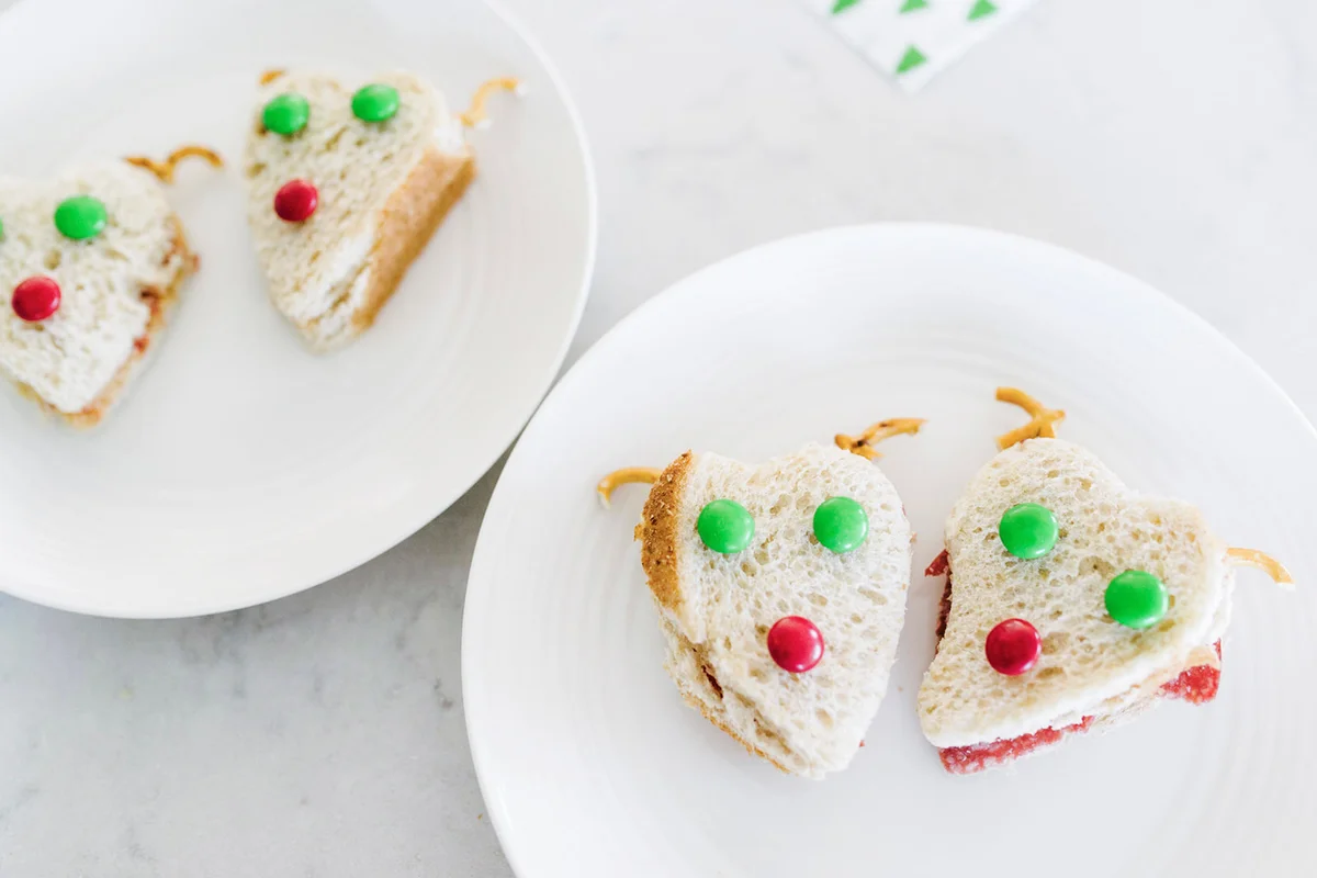 sandwiches with candies served in plates on table