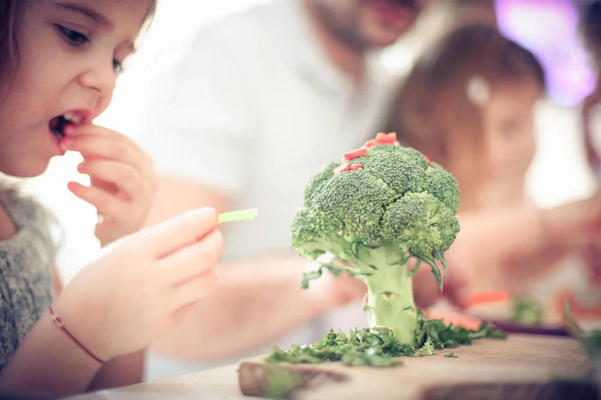 Creativity little girl with vegetable