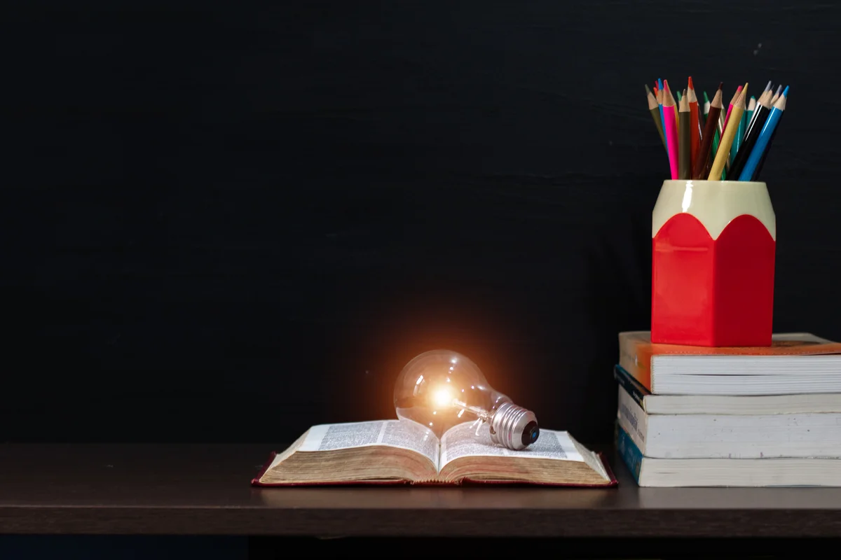books, lightbulb, pencils