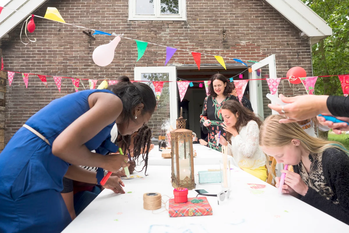 Women making art for birthday party