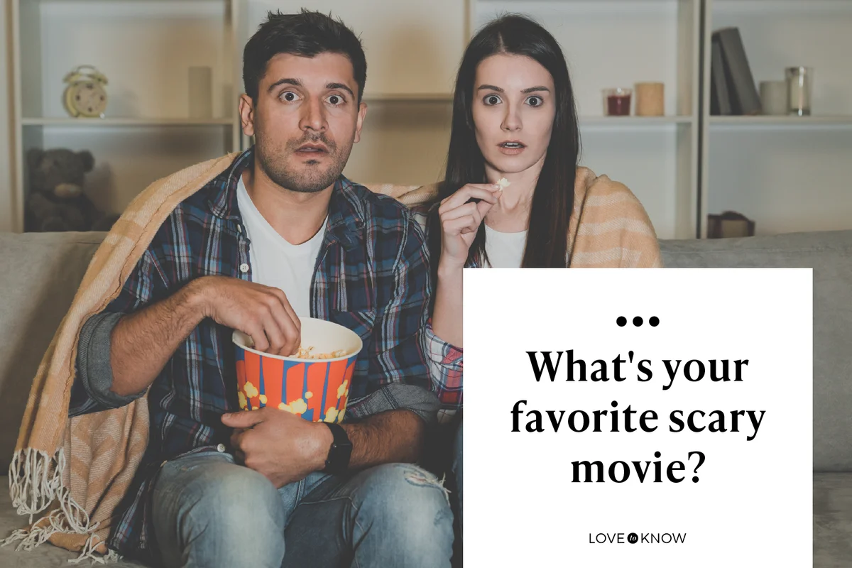 couple eating popcorn and watch a horror movie