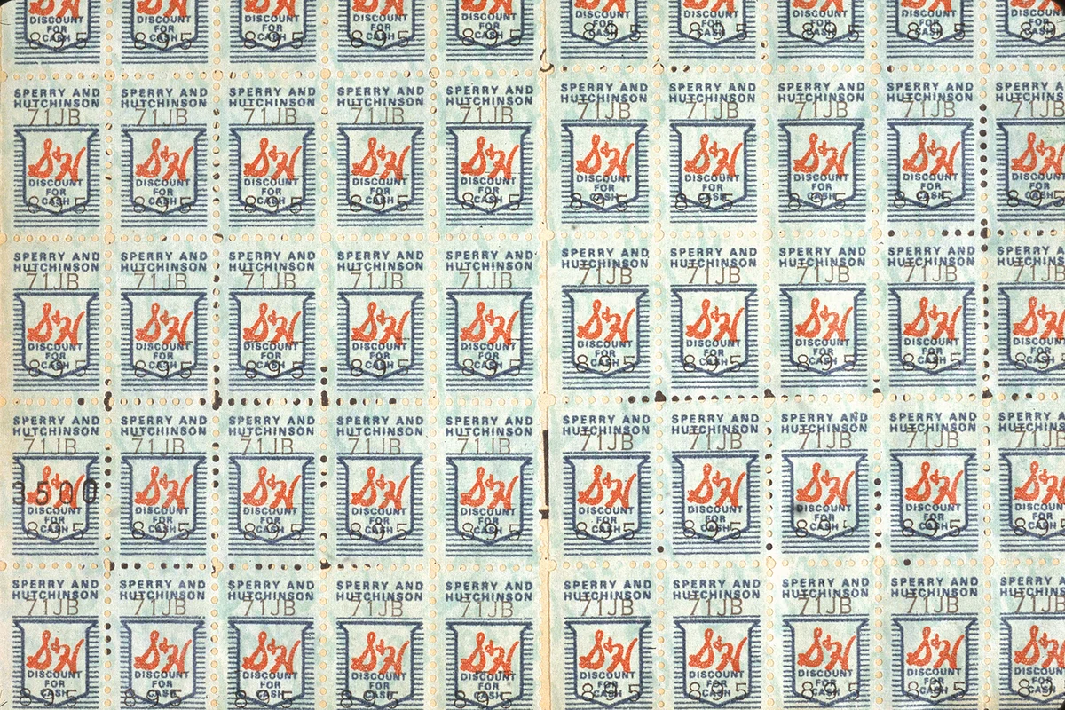 Close-up view of a page of S&H green stamps, used as food stamps to purchase goods, circa 1960