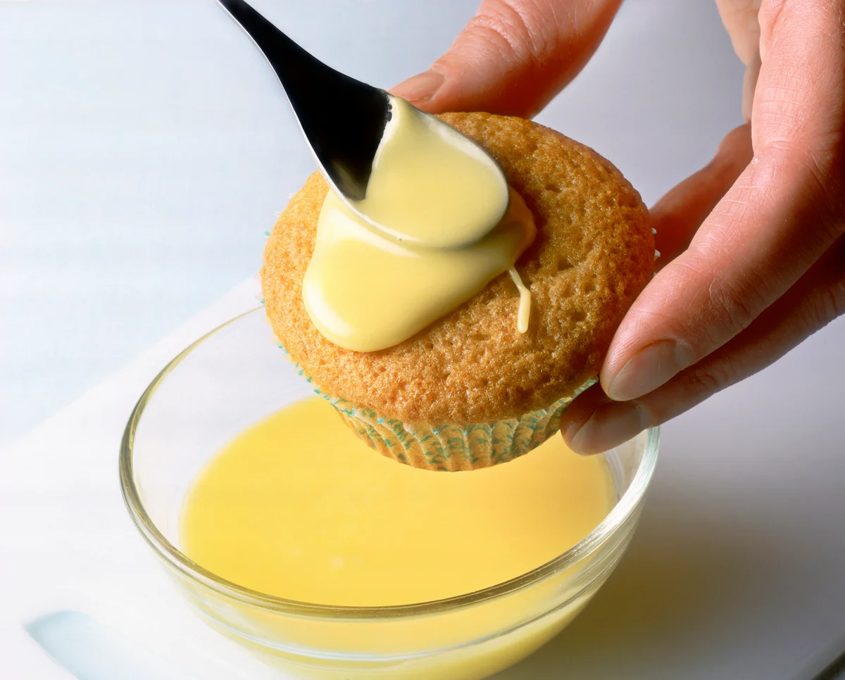 Icing a cupcake