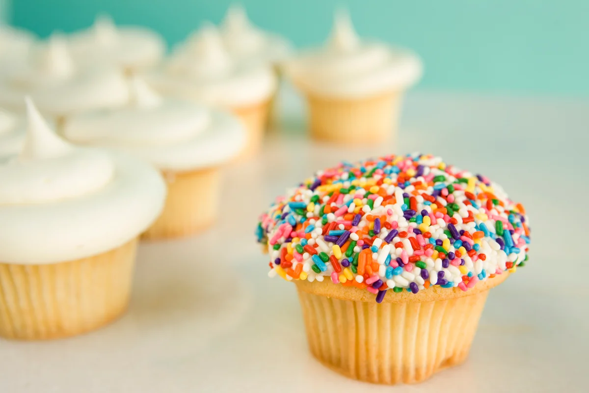 sprinkle-coated cupcakes