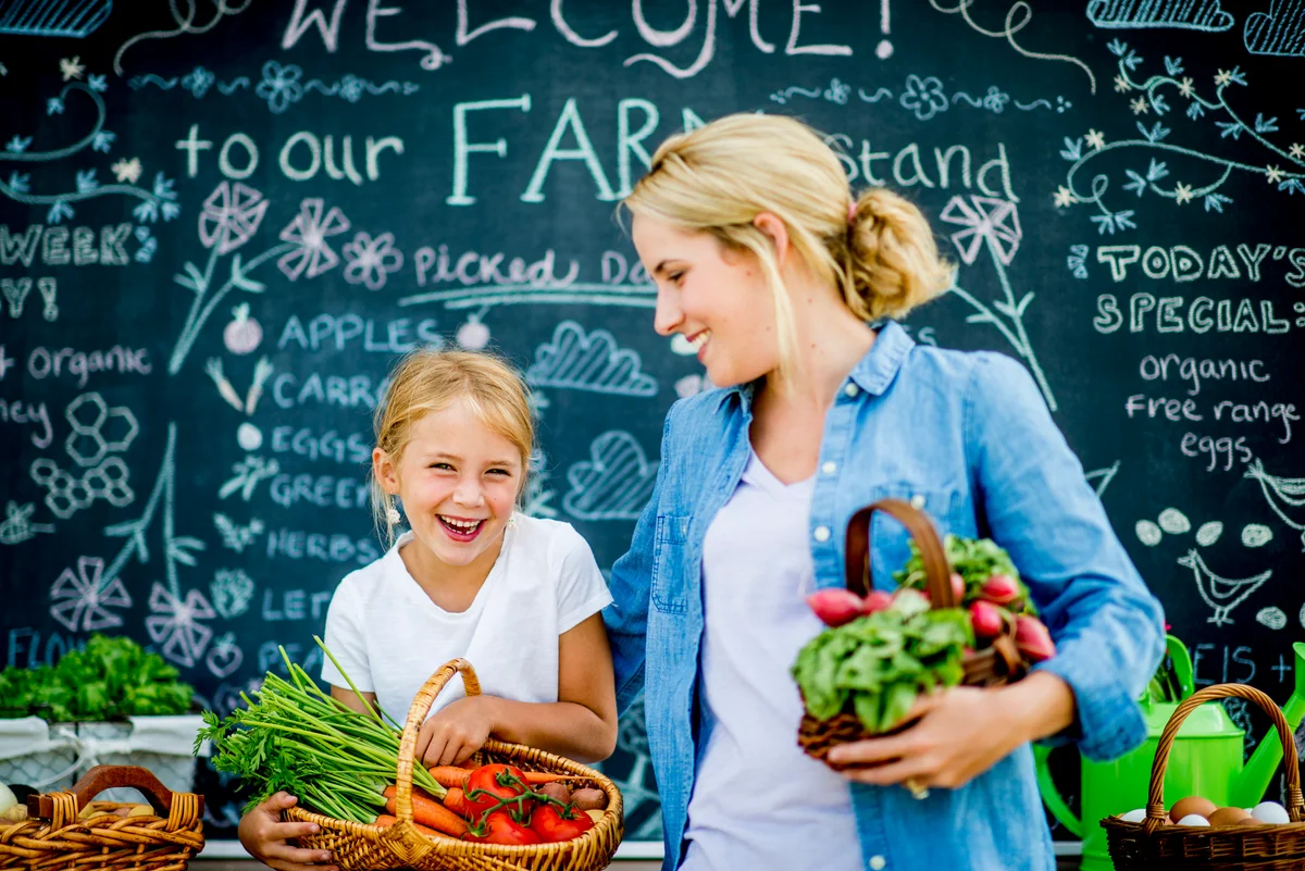 Woman and daughter shopping at farmer's market