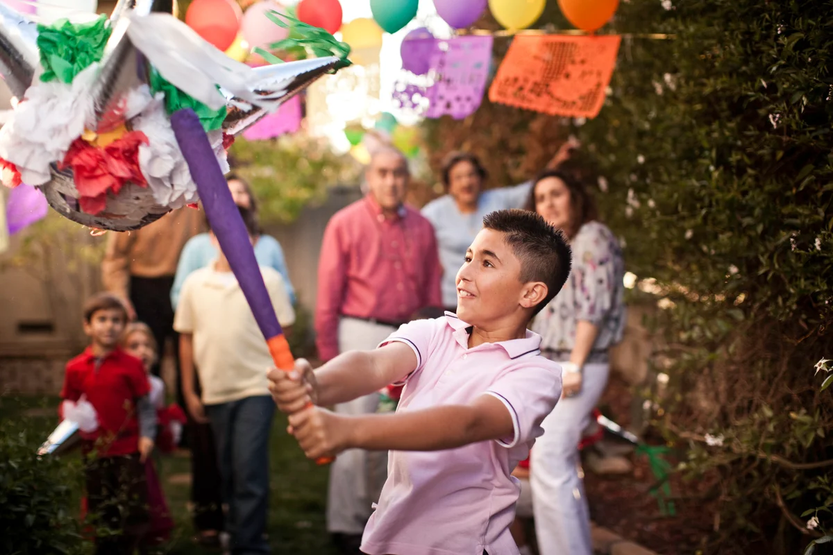 boy hitting pinata