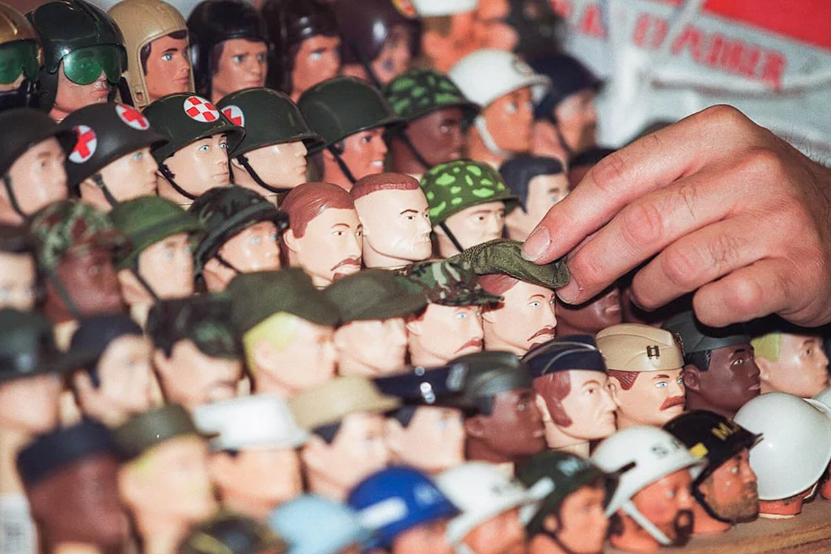Vendors position heads of dolls prior to the opening of the International G.I. Joe Collectors' Convention