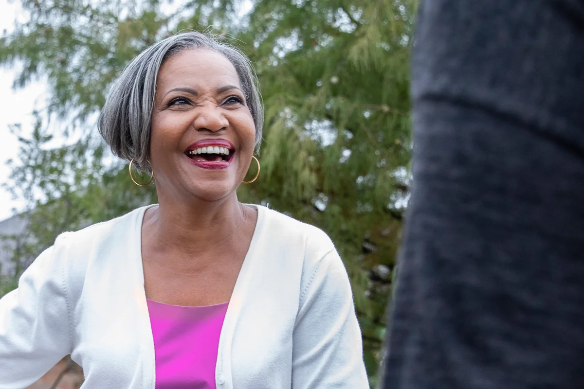 Beautiful older woman smiling with short sleek bob
