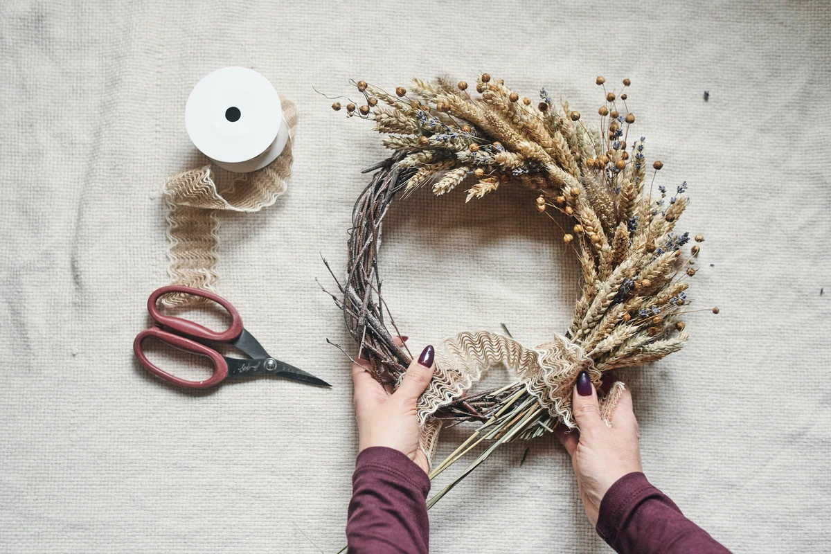 Woman crafting autumn wreath