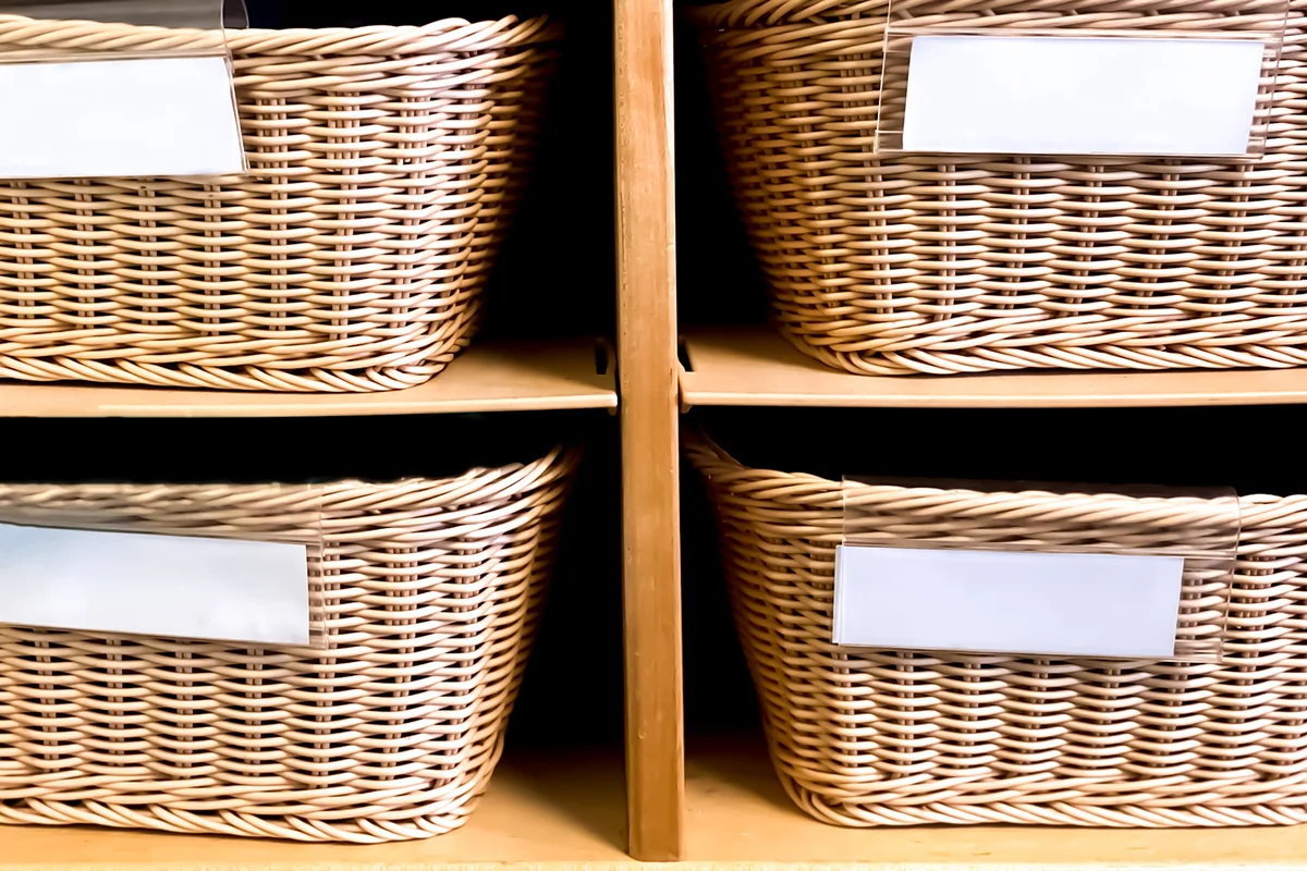 Wicker basket storage cubbies in preschool classroom