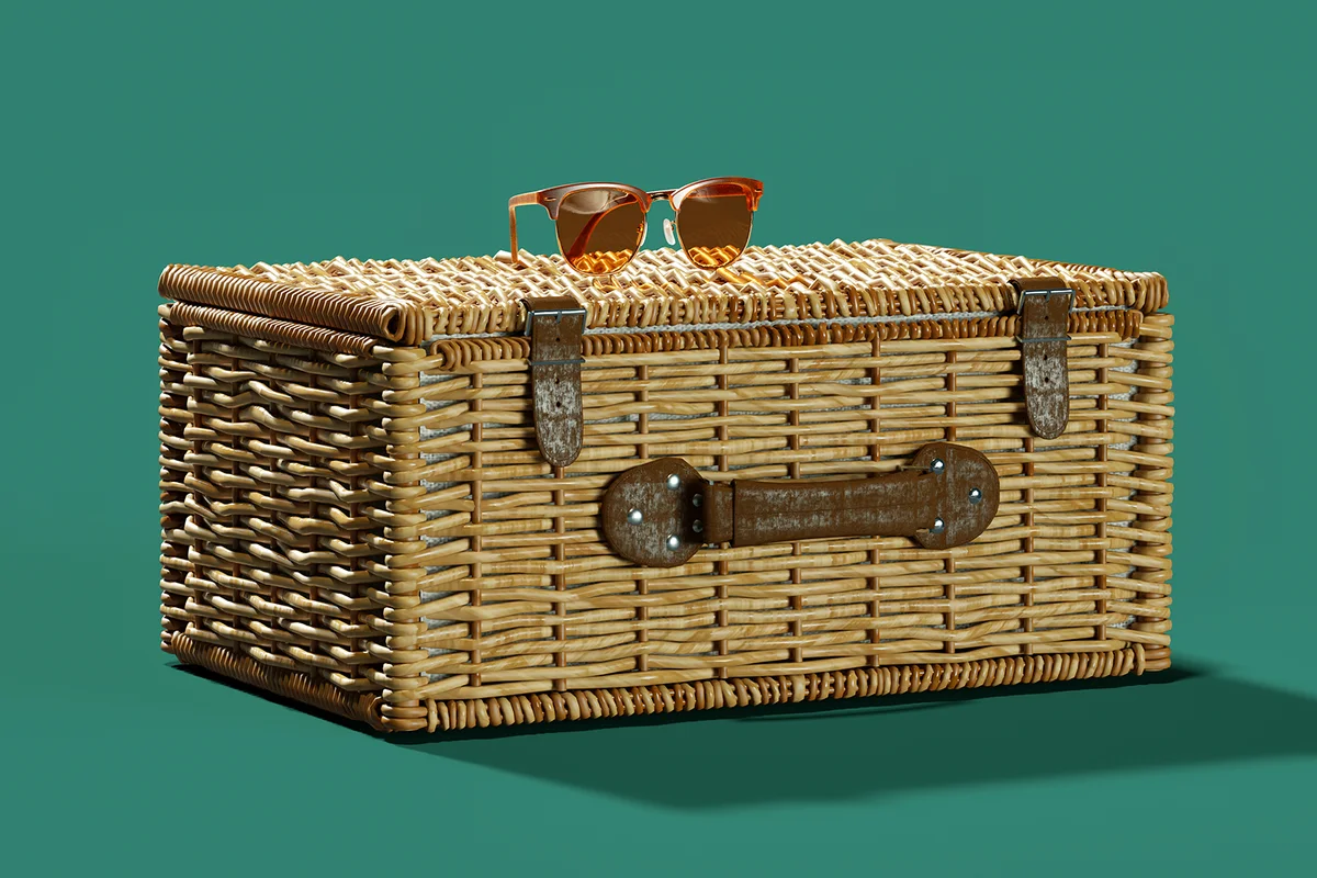 Sunglasses on wicker suitcase