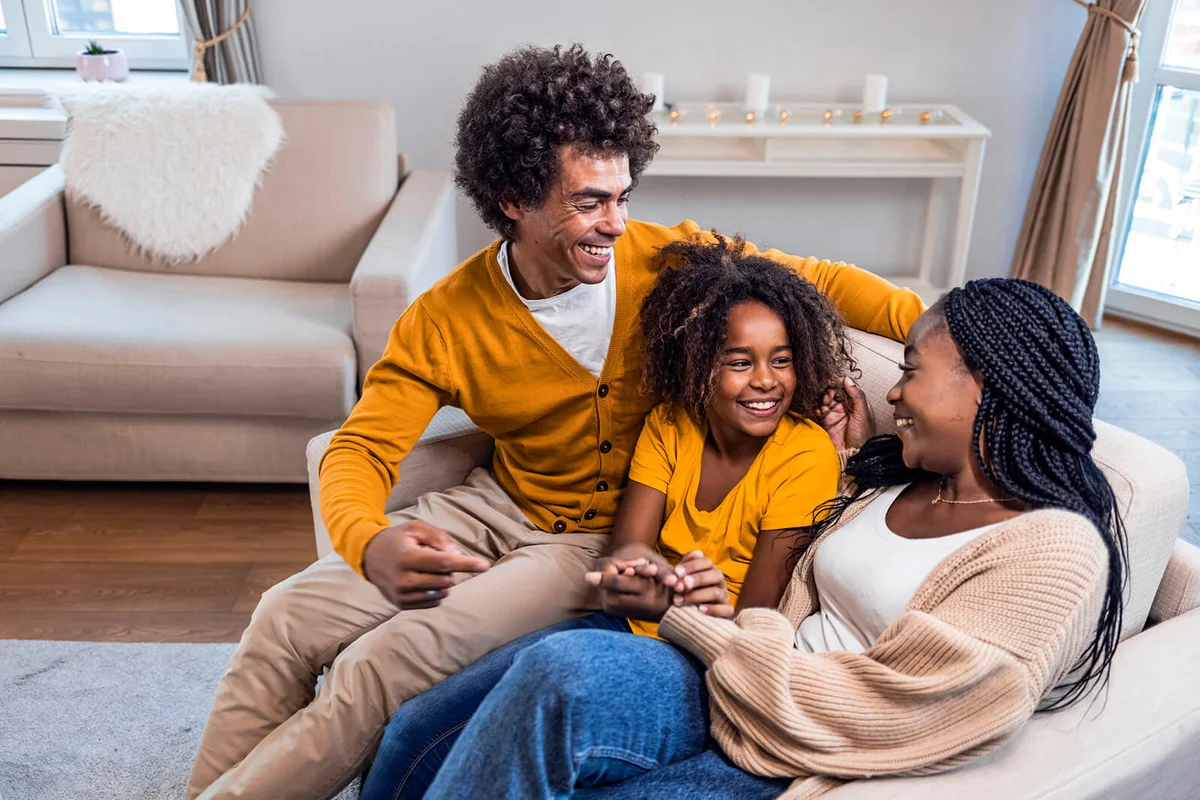 Happy young family having good time together