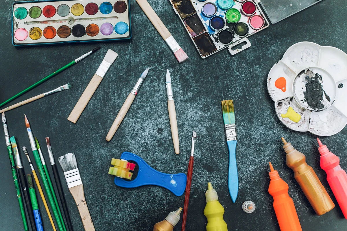 set of color paints on black desk