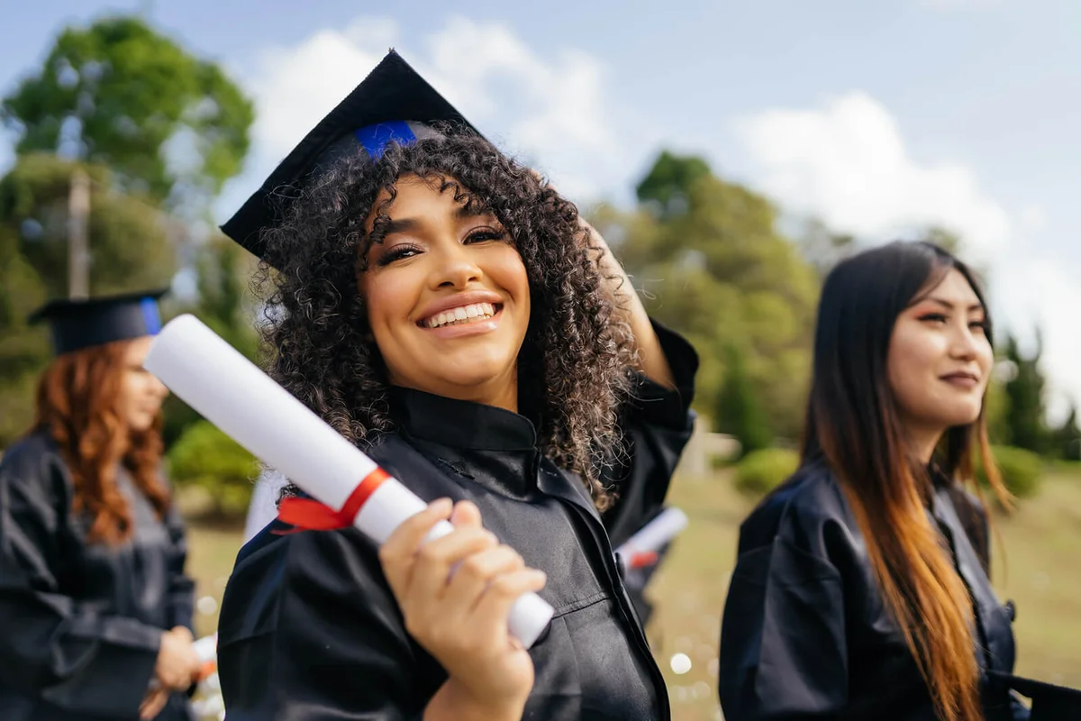 Graduate holding degree