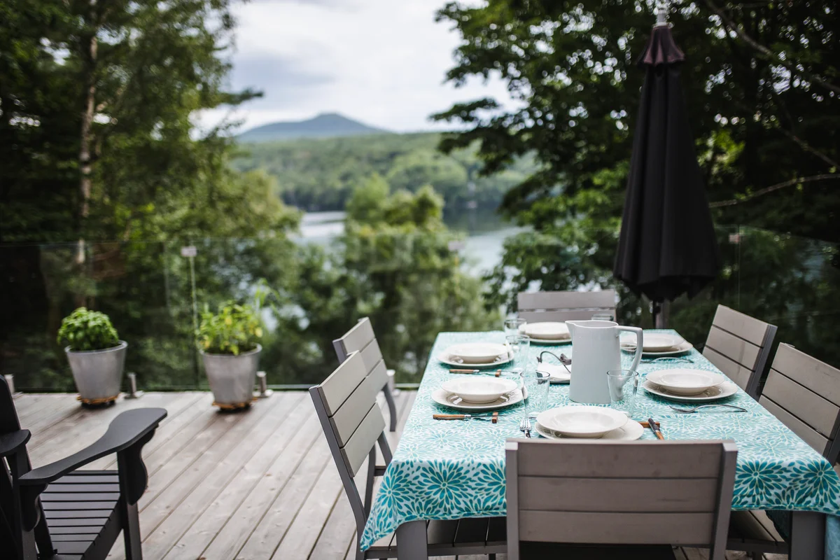 outdoor table set with all white dishes