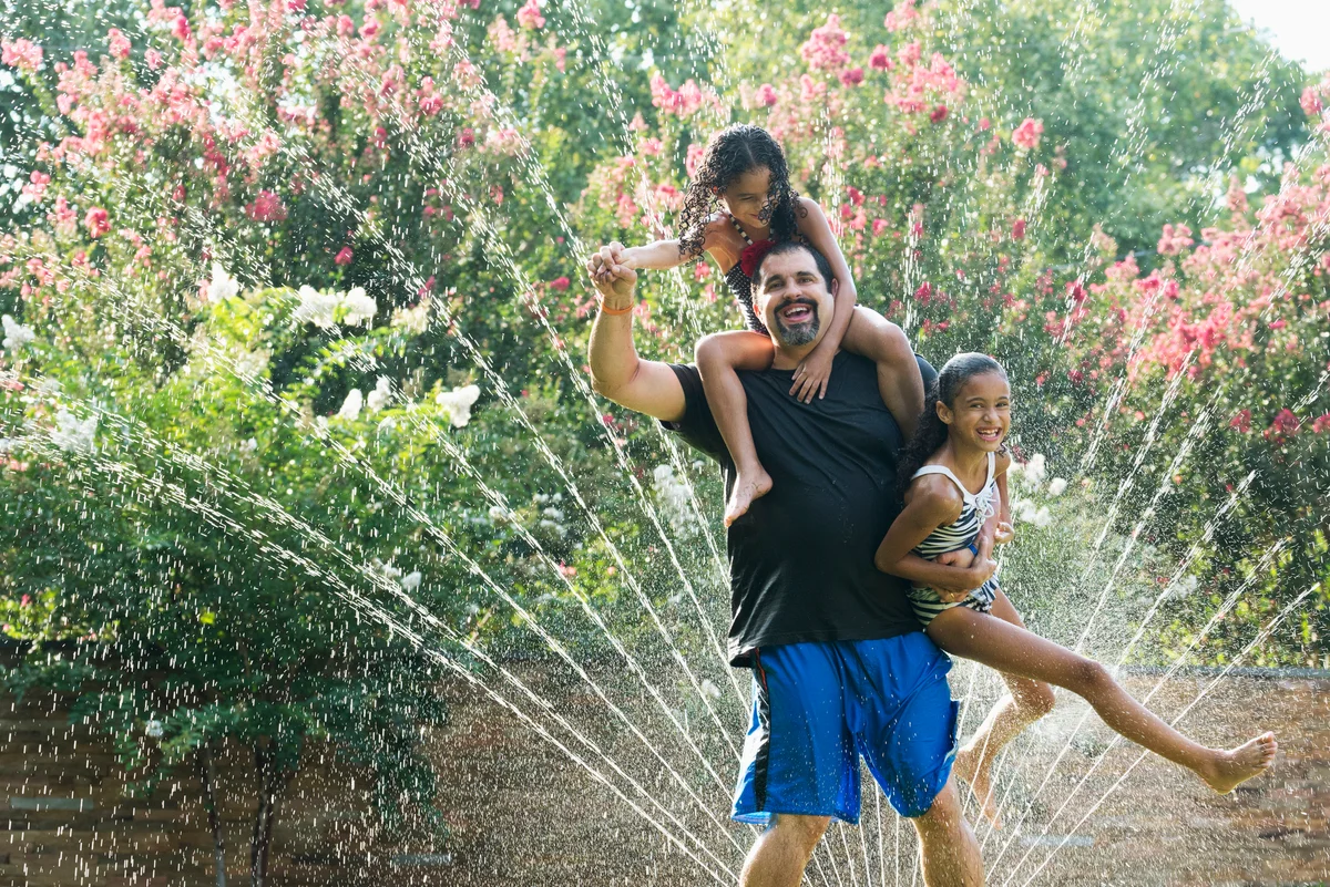 running through the sprinkler