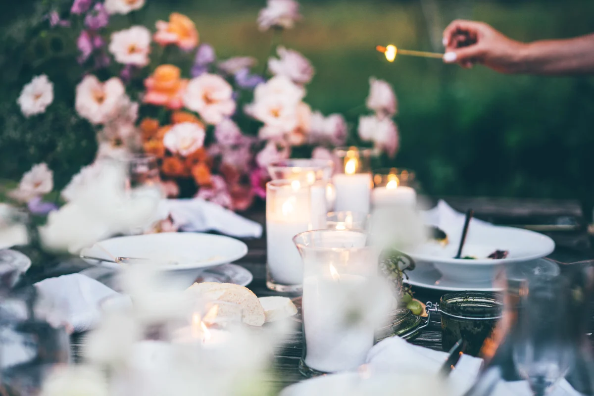 dining table with candles and flower centerpiece