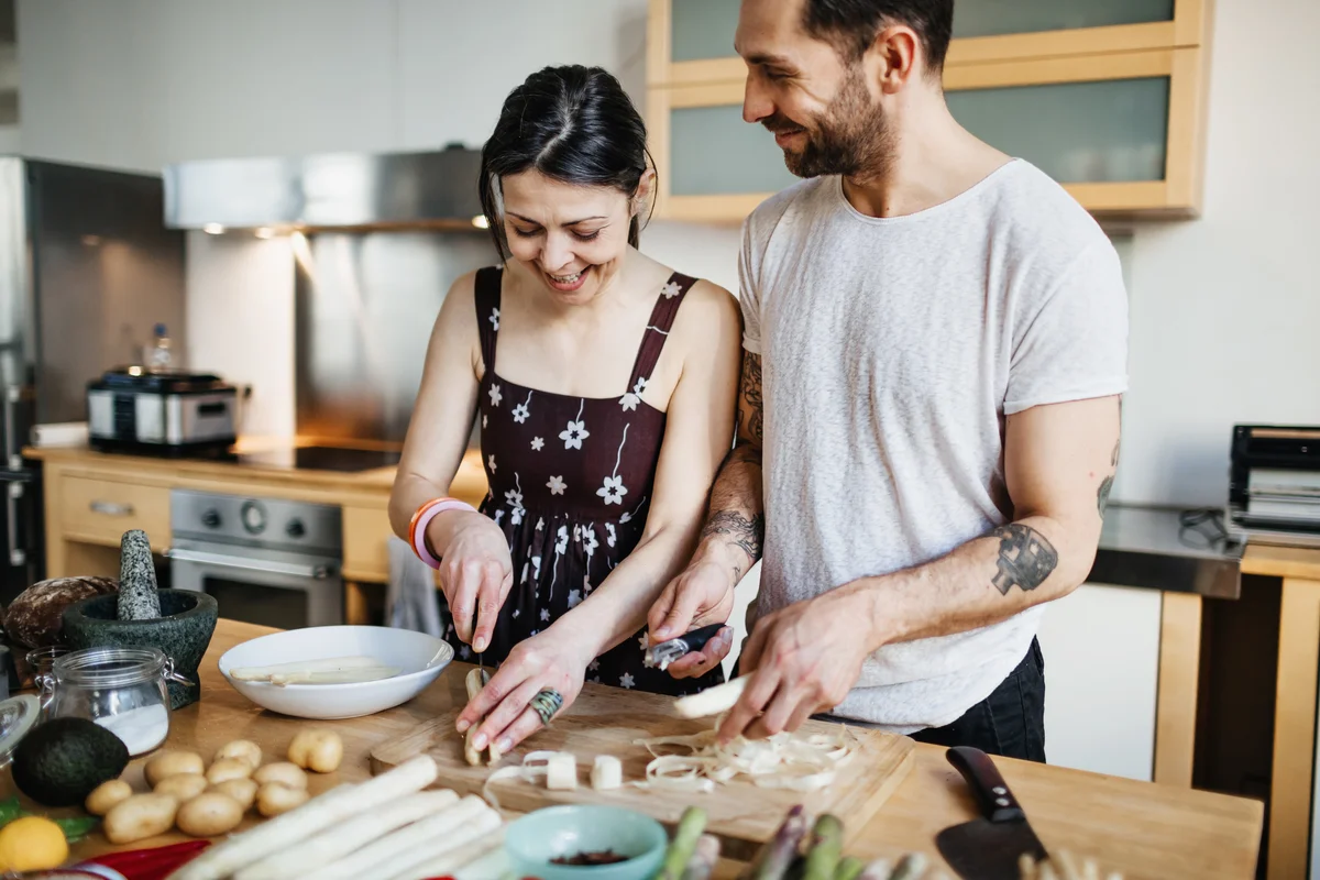 Couple making food in the kitchen