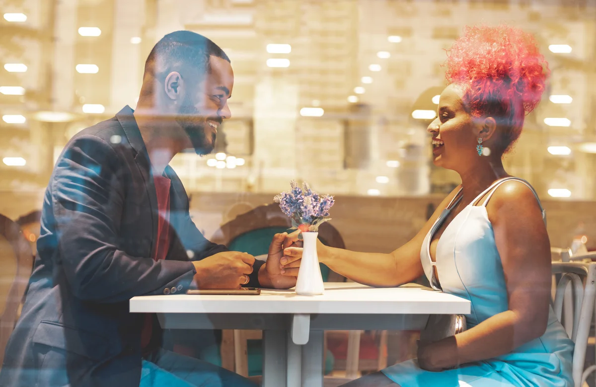 Couple dressed up and eating in nice restaurant