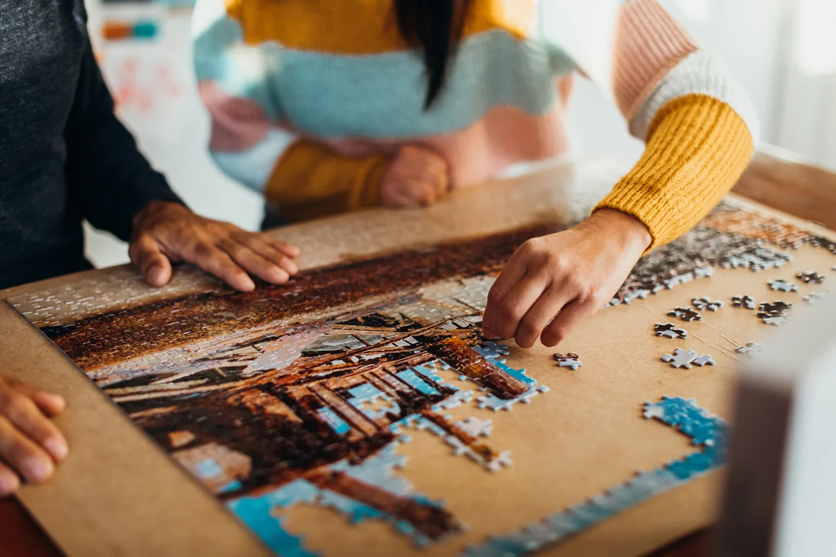 Couple doing puzzle