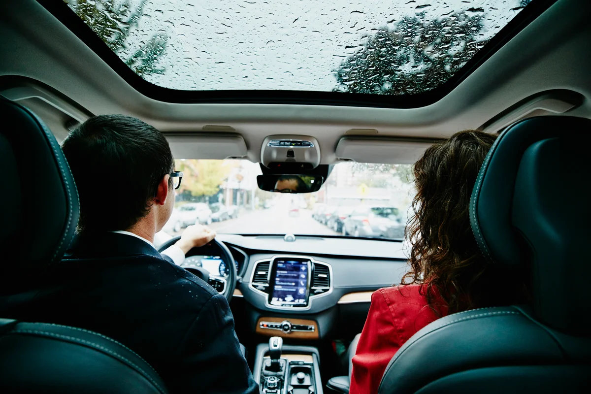 Couple driving in rain