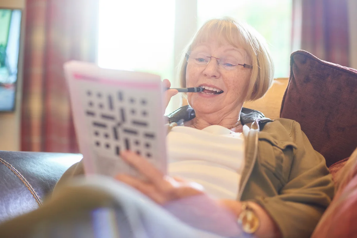 Woman doing crossword puzzle