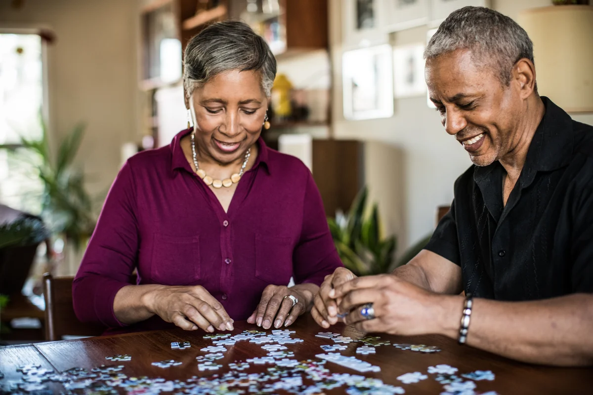 Senior couple doing a puzzle
