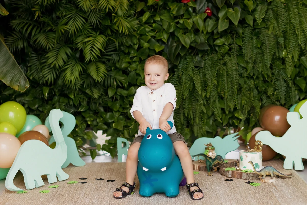 child on a toy horse