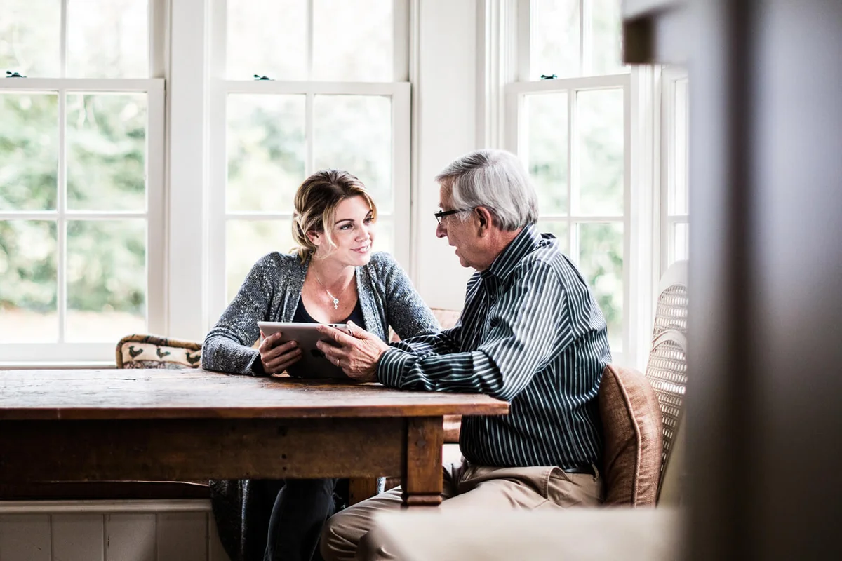 Father and daughter using tablet