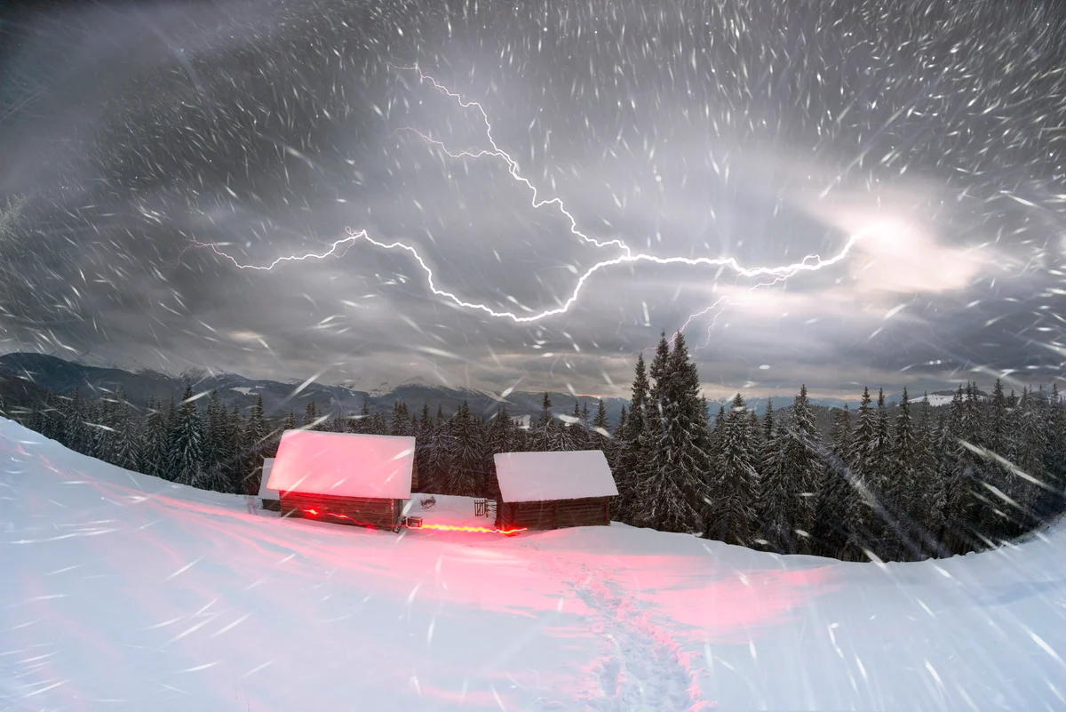 Snowstorm with lightning in sky