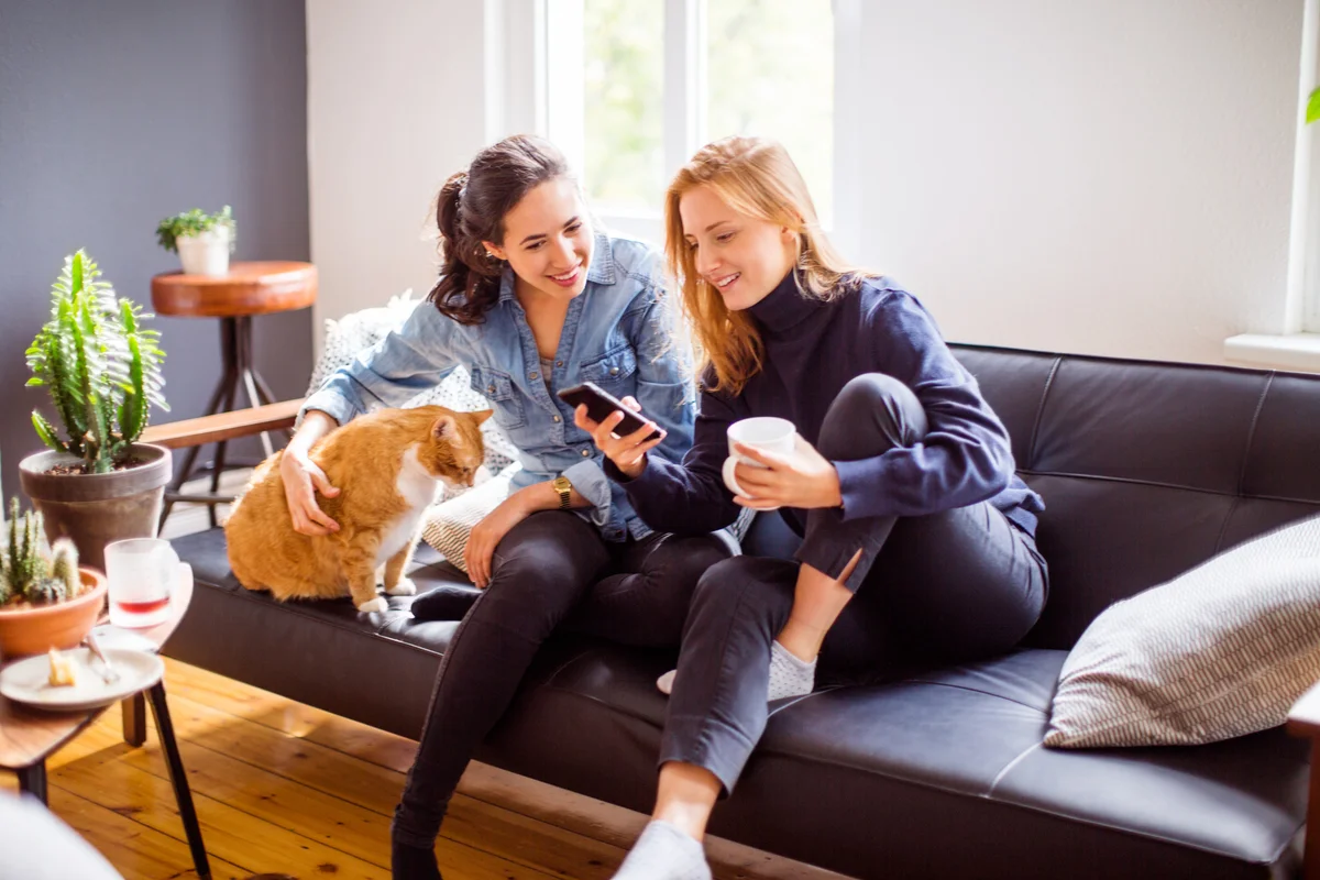 Two women reading something interesting on phone