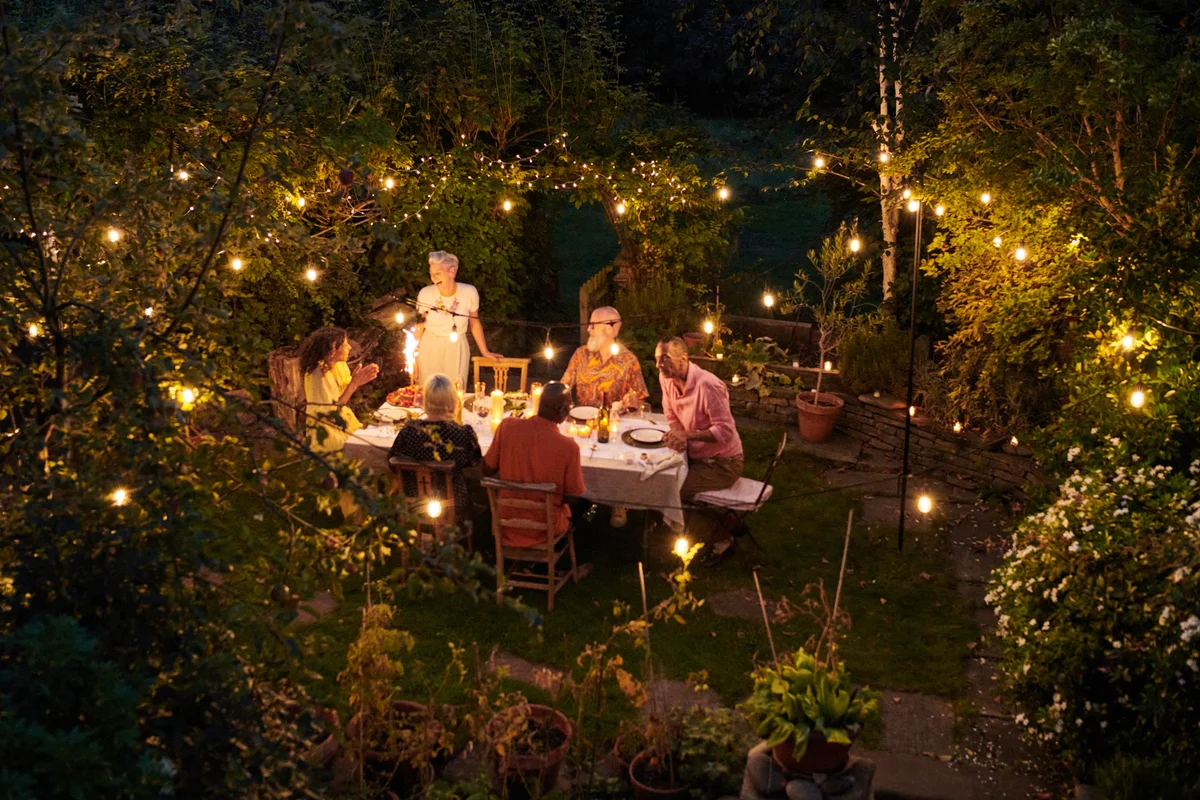 dining outside with twinkle lights