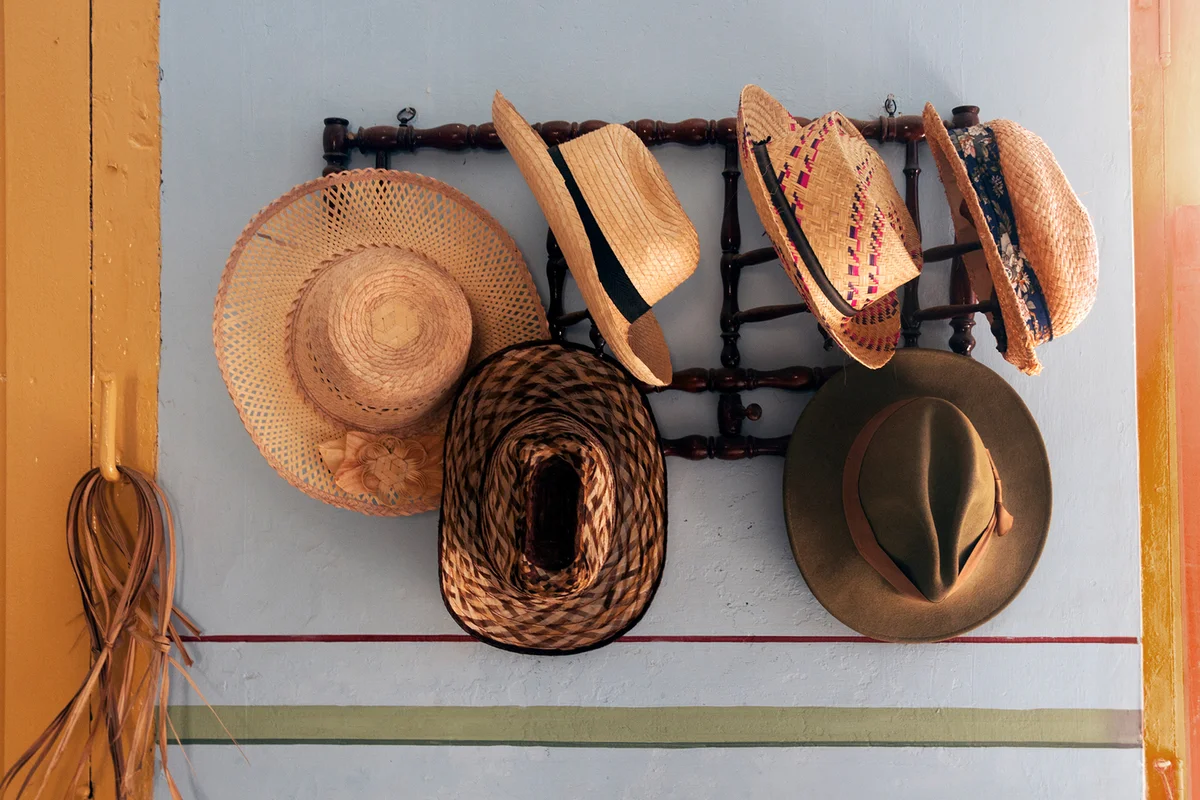 Cuban hats hanging on rack