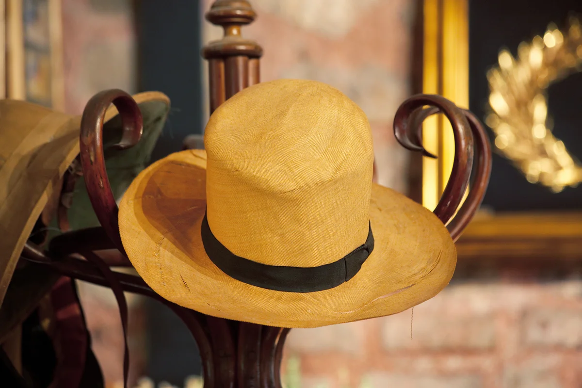 Old Straw Hat on a Cloth Hanger