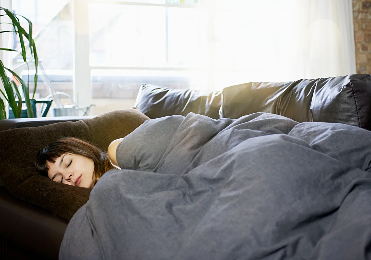 woman asleep on the couch