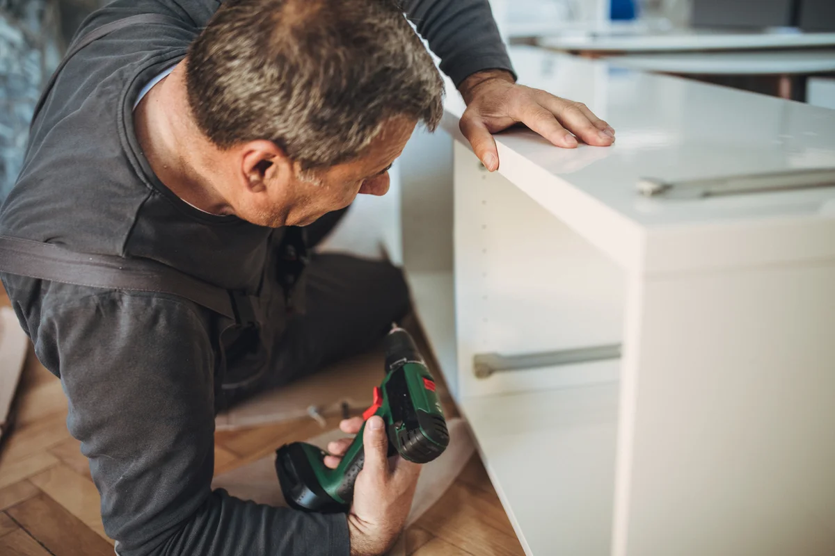 man building shelves