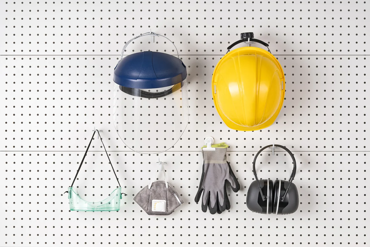 Construction Safety Equipment Hanging on Pegboard