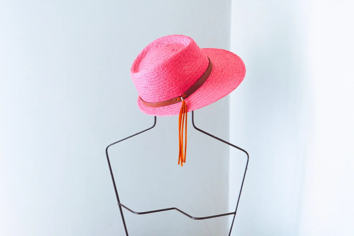 Pink hat on a metallic mannequin